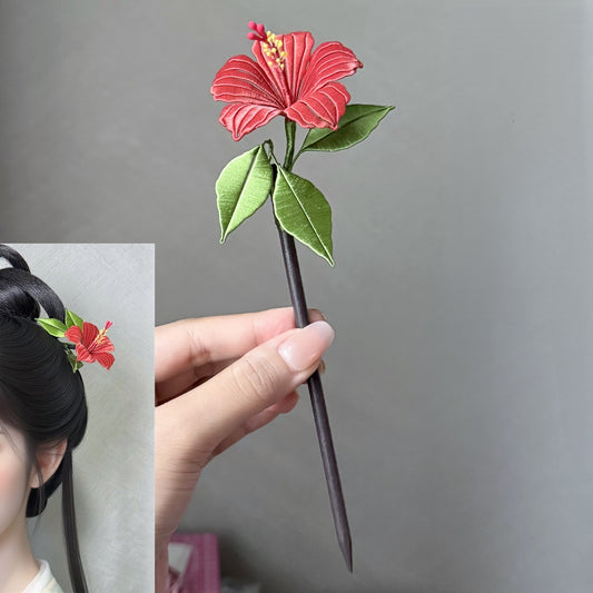 Traditional Chinese entwined silk flower DIY kit showing a completed red hibiscus hairpin accessory for Hanfu styling.