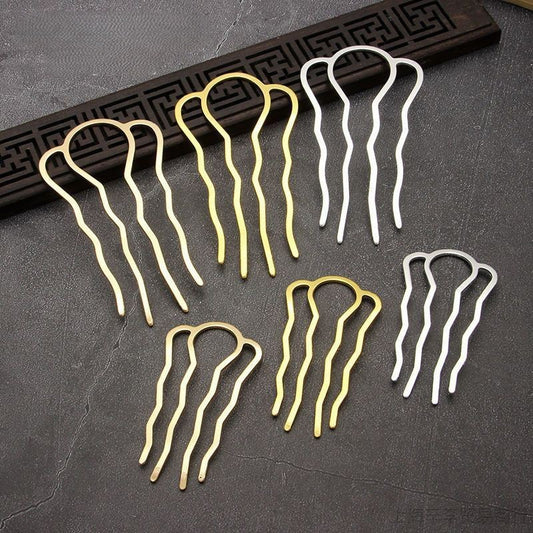 Set of gold and silver four-prong hair pins on a textured surface, highlighting their versatility for updos and craft use.