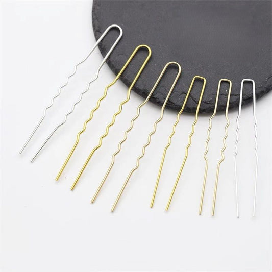 Set of U-shaped wavy copper hair pins, 75mm long, in gold and silver electroplated finish, zigzag wave design, displayed on black slate round plate