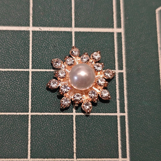 Close-up of Rose Gold-Tone Flatback Snowflake Flower Center with Pearl for DIY Crafts (16mm)