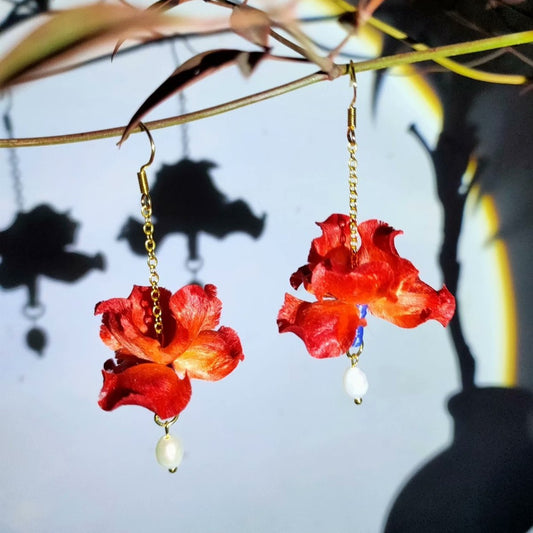 3D silk velvet flower jewelry depicting artisanal red irises made with traditional Ronghua techniques on gold-tone hooks.