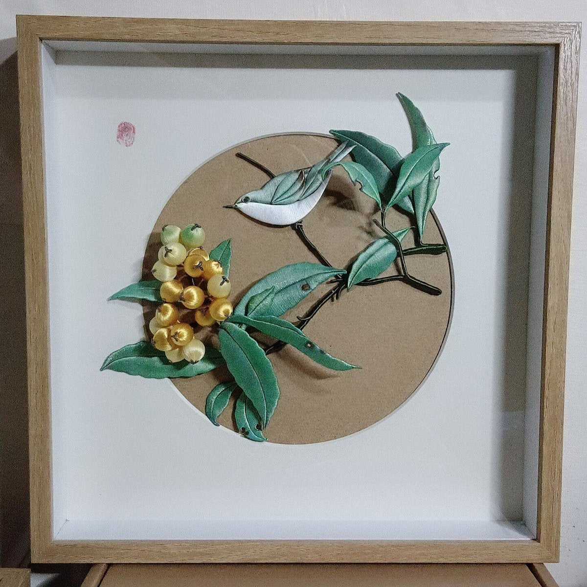 Handmade Chanhua 3D embroidery featuring a bird and yellow loquats in a wooden frame.