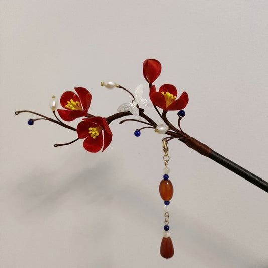 Handmade Ronghua red plum blossom velvet flower hairpin with natural mulberry silk, yellow stamens, white butterfly, pearls, and red agate tassel