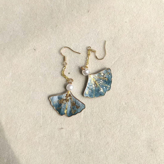 silk velvet leaf jewelry depicting artisanal Ginkgo Biloba leaves made with traditional Ronghua techniques on gold-tone hooks.