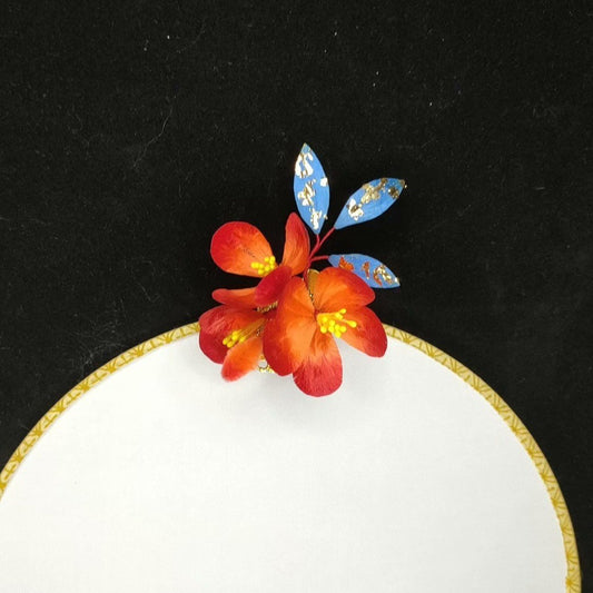 3D silk velvet flower hair accessory depicting blooming red blossoms made with traditional artisanal Ronghua techniques.