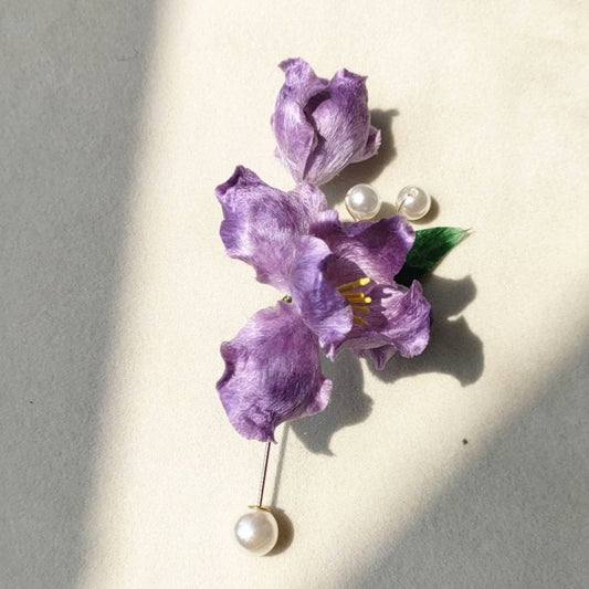 3D silk velvet floral brooch featuring a purple iris blossom made with traditional artisanal Ronghua techniques.