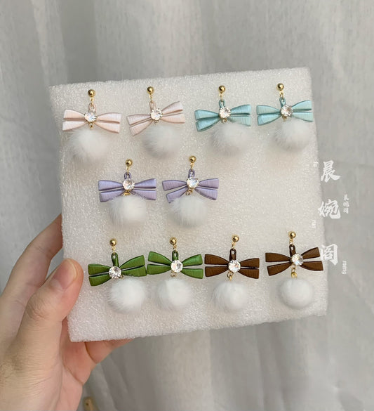 Handmade Chanhua bow pom pom earrings set in 5 colors (pink, peach, blue, purple, green/brown), thread bow drop earrings with crystal and fluffy pom pom