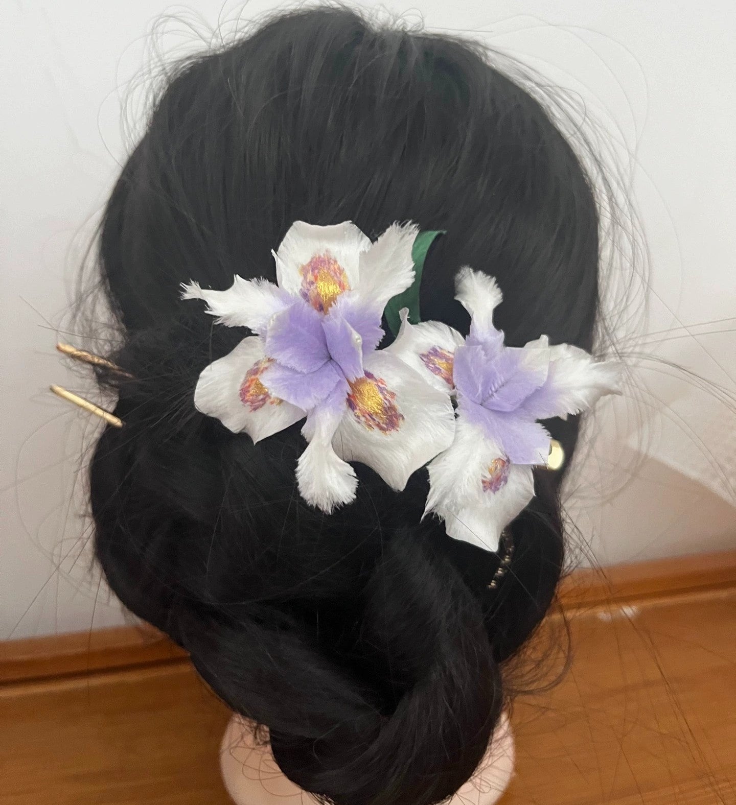 Elegant dark updo adorned with a set of two handmade white and lavender mulberry silk Ronghua Iris hair pins (without clips).