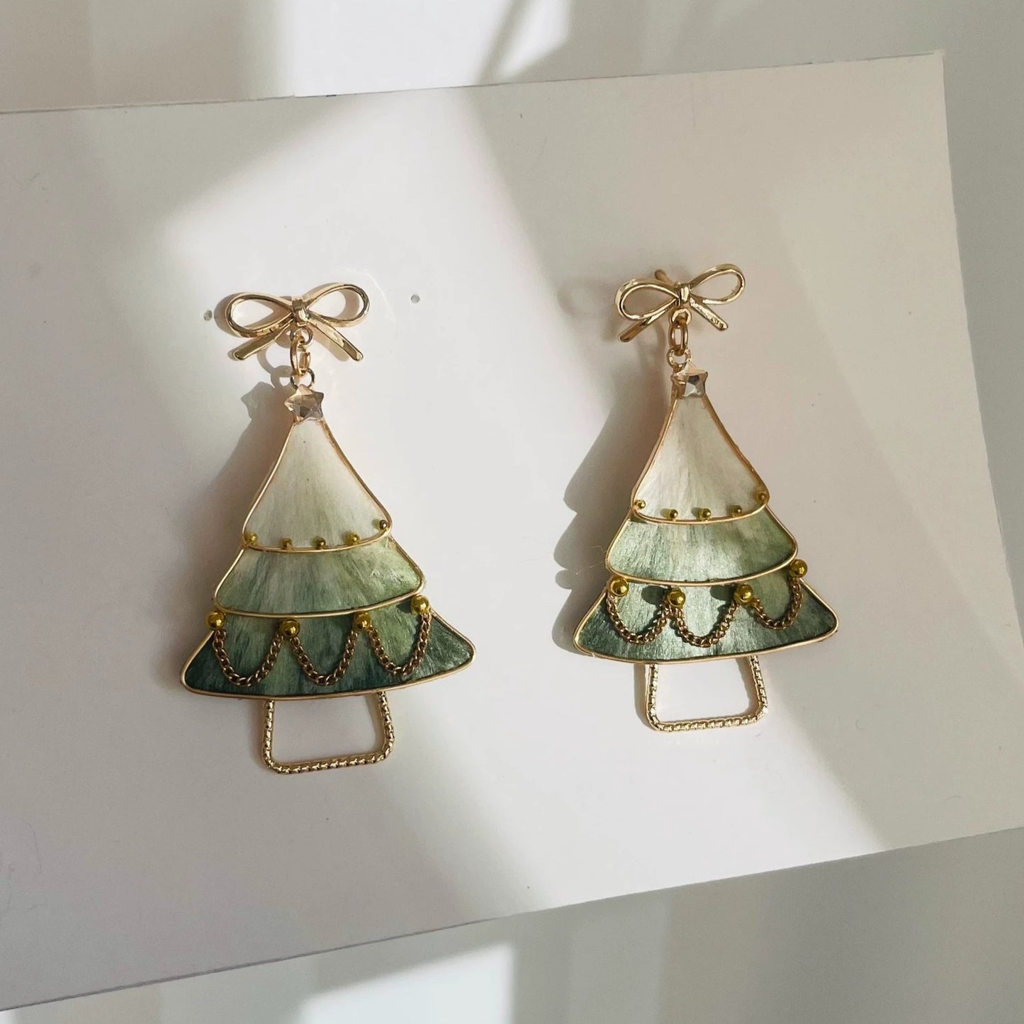Handmade Ronghua Christmas tree drop earrings in green-white mulberry silk velvet with gold bow and crystal star