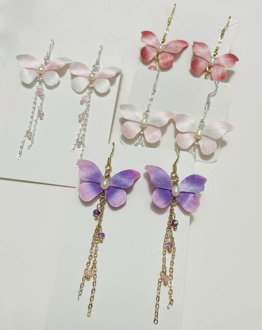 Handmade Ronghua silk butterfly long drop earrings in pink, purple and white mulberry silk velvet with pearl body and chain tassels