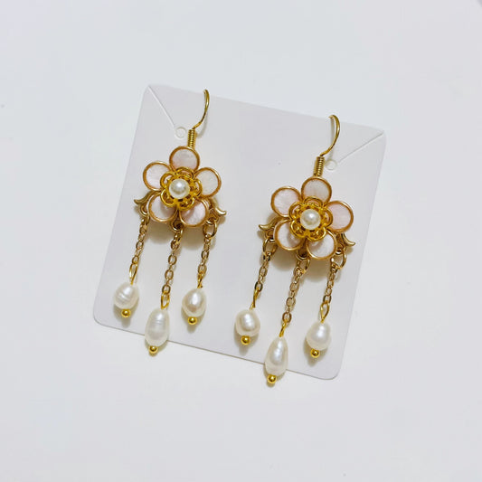 Handmade Ronghua pink plum blossom long tassel earrings in mulberry silk velvet with pearl center and gold chain drops