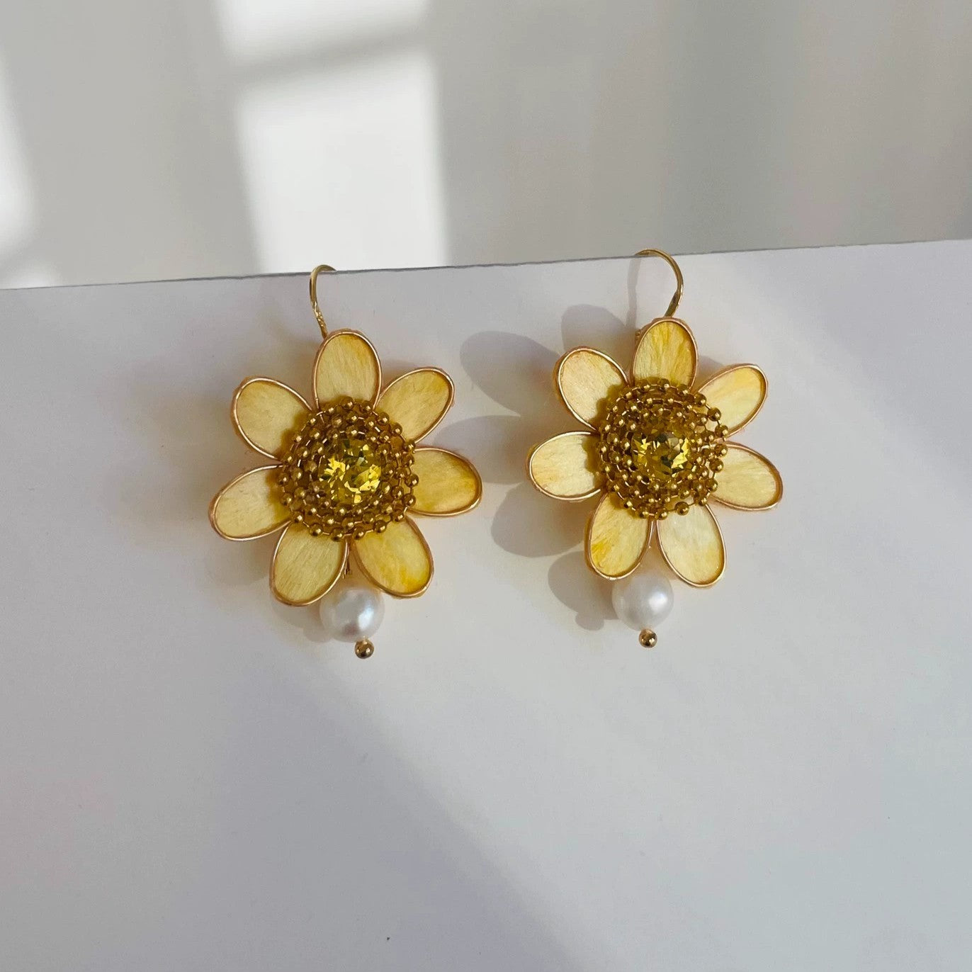 Handmade Ronghua sunflower drop earrings in golden-yellow mulberry silk velvet with pearl and crystal center on gold hooks