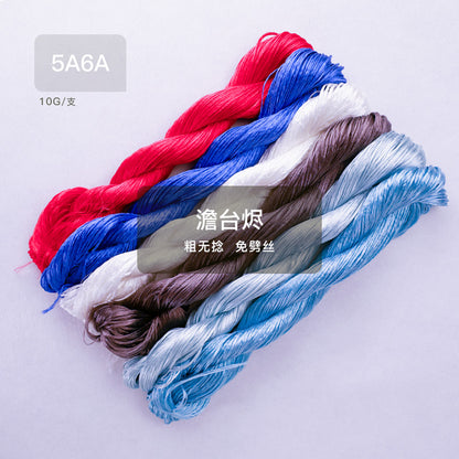 A set of six 10g bundles of thick, untwisted mulberry silk thread, featuring a vibrant palette of red, blue, white, and earthy tones.
