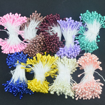 Assorted bundles of 6cm long artificial flower stamens, neatly tied with white string, showcasing the multiple color options available.