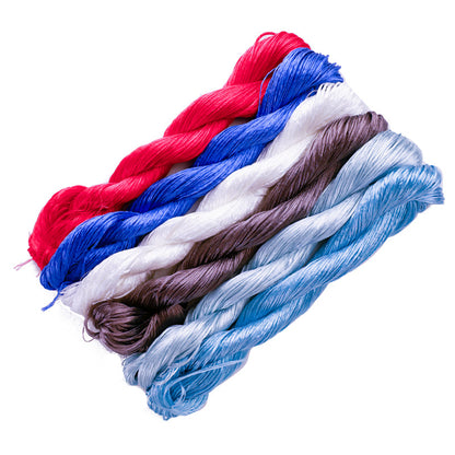 An angled close-up of six 10g bundles of untwisted mulberry silk thread from the "Tan Tai Jin" (澹台烬) collection, showcasing a color combination of red, blue, and light-toned hues.