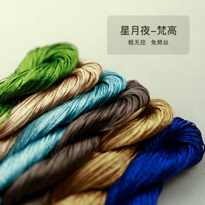 A close-up, angled shot of a set of six thick, untwisted mulberry silk threads from the "Starry Night" (星月夜) collection, showing a palette of greens, blues, and earthy tones.