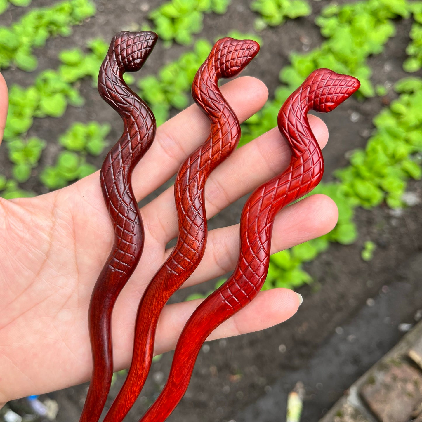 Natural rosewood hair stick 20cm snake design with textured scale pattern, deep reddish smooth uncoated finish
