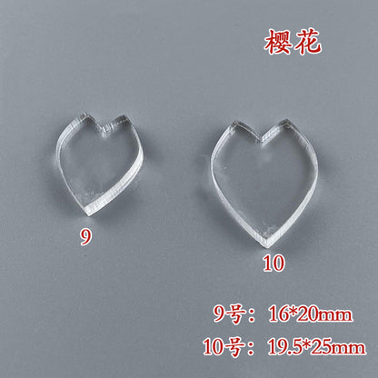 A close-up of two cherry blossom petal wire shaping templates, showing a size comparison and measurements.