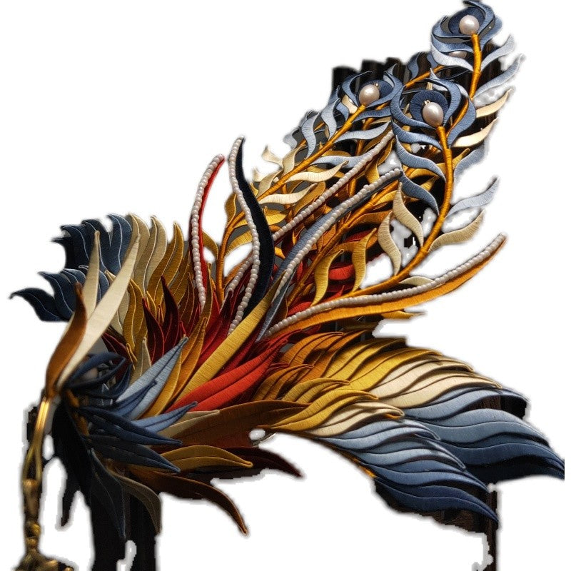 Close-up of a completed DIY Chanhua phoenix hair ornament with intricate blue, gold, and red silk threads and pearl embellishments.