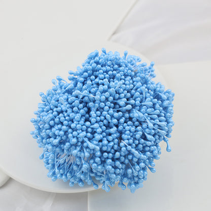 Bundle of sky-blue 3mm glossy artificial flower stamens on a clean white background, showing their size and texture clearly.