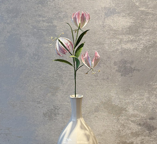 Finished pink and white Gloriosa Lily flower stem made from the DIY Chanhua velvet flower kit, displayed in a white vase.