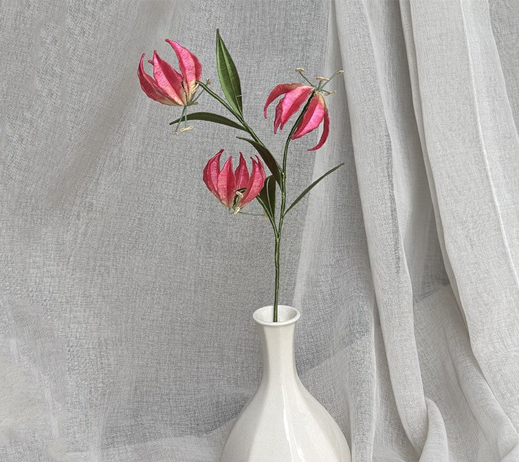 Completed red Gloriosa Lily flower branch, a finished DIY Chanhua craft kit project, shown in a white vase.