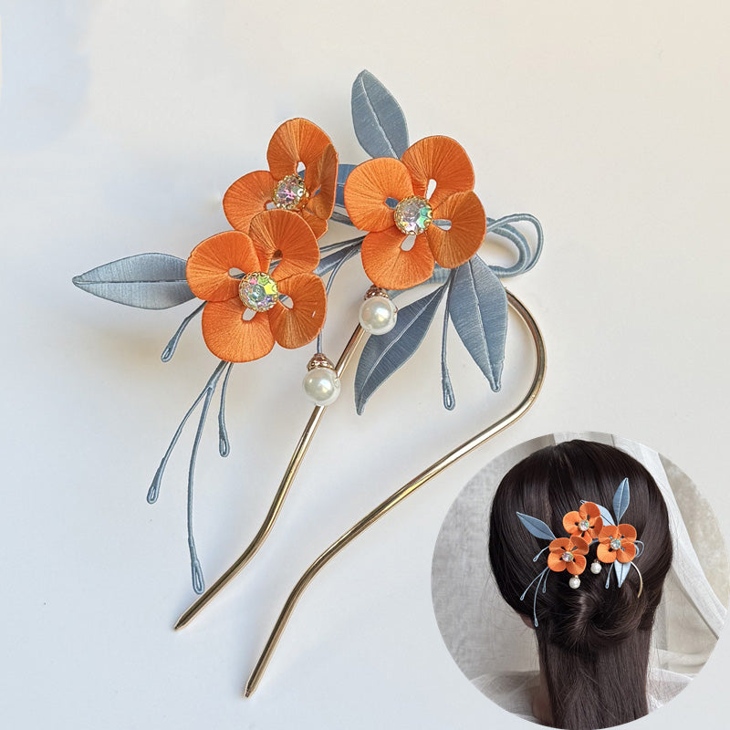 Finished orange DIY Chanhua flower hair fork with blue leaves and pearl accents, with inset model wearing it.