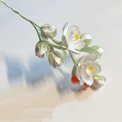 Completed white crabapple flower display with pink edges, a finished DIY Chanhua craft kit project.