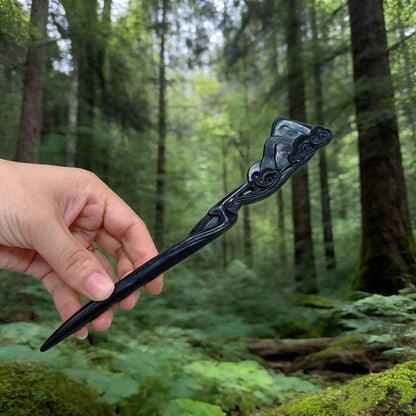 Natural African blackwood hair stick 20cm with landscape design motif, deep black smooth uncoated finish in forest setting
