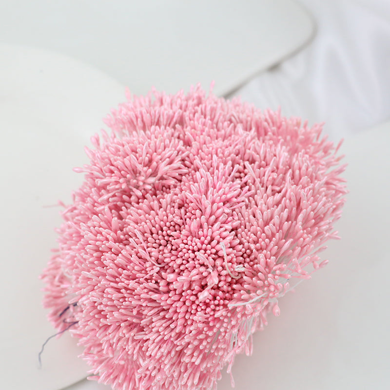 Close-up of a bundle of pink 1.5mm pearlescent artificial flower stamens showing their detailed texture.