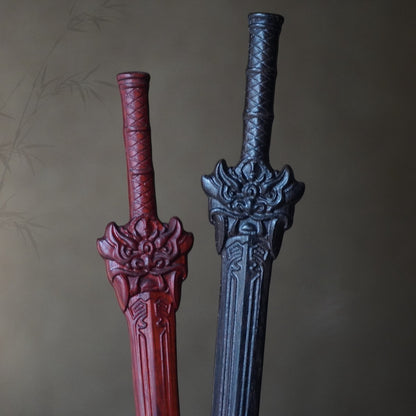 Set of three natural wood sword hair sticks in rosewood, African blackwood, and boxwood with lion jue dragon guard design