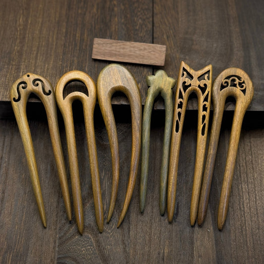 Set of 6 natural Green Sandalwood U-shaped hair forks with carved designs, 13-15cm length, on wooden background.