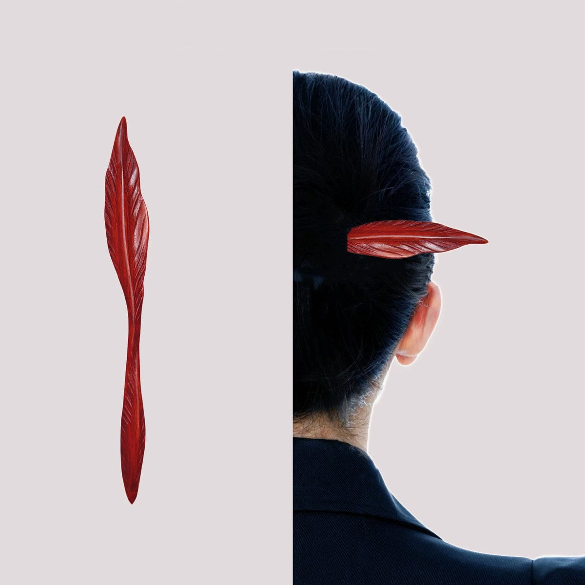 Close-up of polished African padauk hairpin featuring detailed leaf vein carving in rich red tone