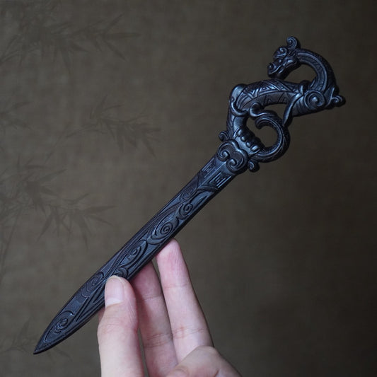 Natural African blackwood 18.8cm hair stick with dragon chant sword design held in hand