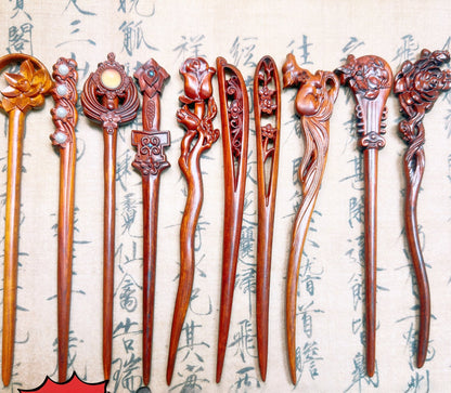 Natural Burmese rosewood hair stick set with carved designs on long wooden pins, smooth uncoated finish in rich reddish tone