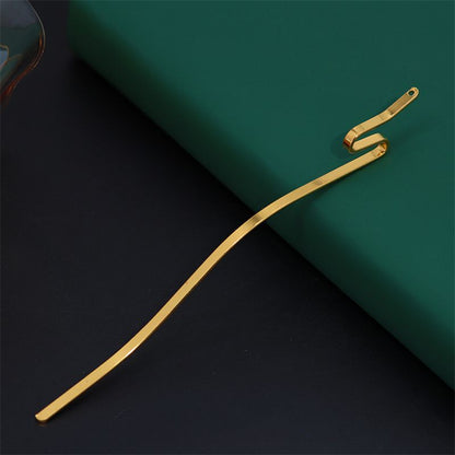A single serpentine metal hair stick in a gold finish with a wavy body and pierced top for DIY crafts.