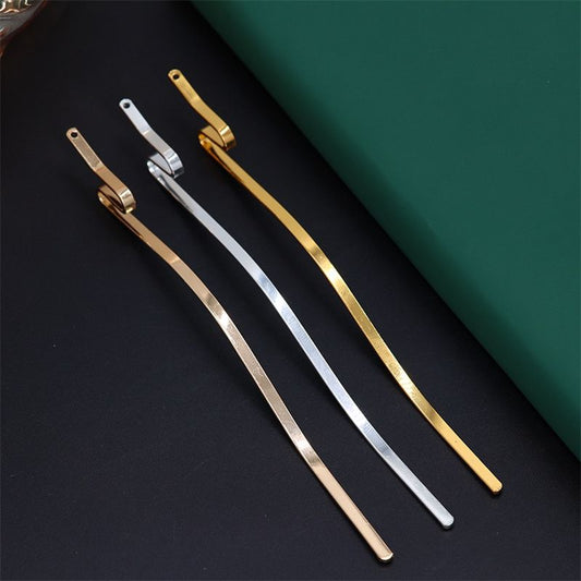 An assortment of serpentine hair stick findings in gold, silver, and light gold finishes for jewelry making.