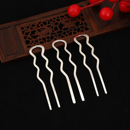 Three silver-tone wavy hairpins with looped tops, designed for a secure hold in updos.