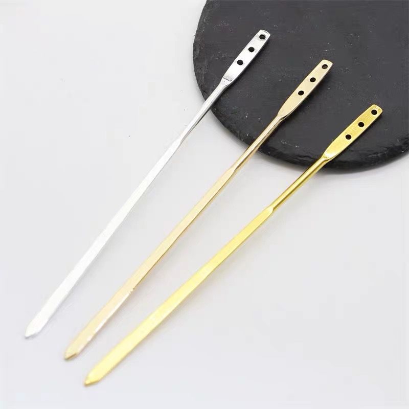 Three metal hair stick blanks in gold and silver, displayed as essential craft supplies for jewelry making.