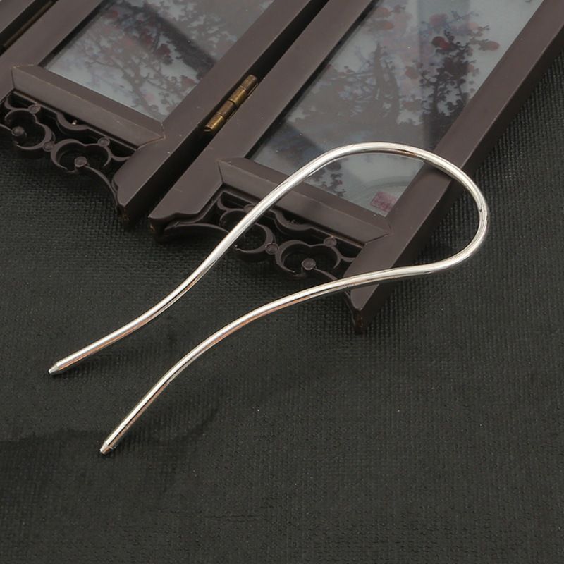 A single 110mm silver alloy minimalist hair fork, showing its clean lines and arch shape.