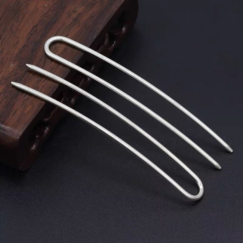 Silver 2-prong alloy hair pin displayed against dark background, versatile for DIY crafts and direct hairstyle application.