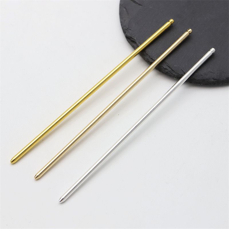 Three straight metal hair sticks in gold, light gold, and silver finishes for color comparison.