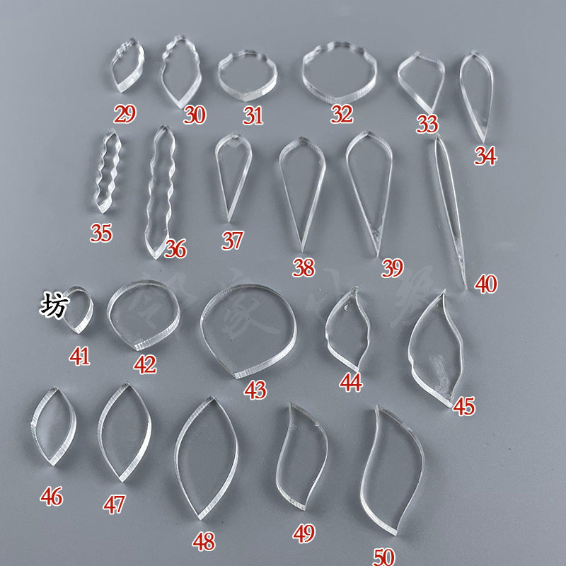 Various clear acrylic wire shaping templates, including ovals, marquise, and teardrop shapes for creating leaves and abstract designs.