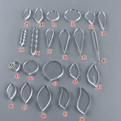 Various clear acrylic wire shaping templates, including ovals, marquise, and teardrop shapes for creating leaves and abstract designs.