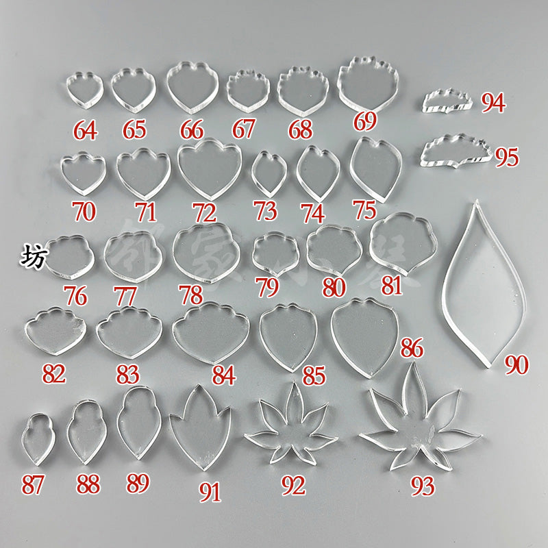 An assortment of clear acrylic petal and leaf shaping templates for wire wrapping, numbered 64 through 95.