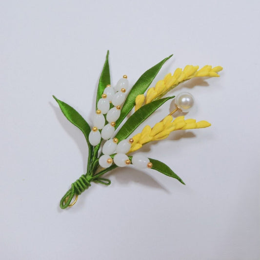 3D embroidery wheat ear pin symbolizing harvest, made with intricate artisanal thread-wrapping techniques.