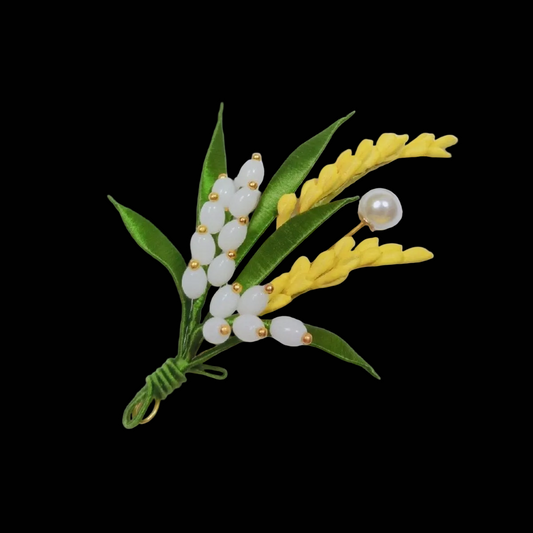 Handcrafted Chanhua brooch featuring thread-wrapped yellow and white wheat ears with green leaves and a pearl accent.