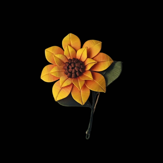 Handcrafted Chanhua sunflower brooch with yellow and orange thread-wrapped petals and a detailed brown center.