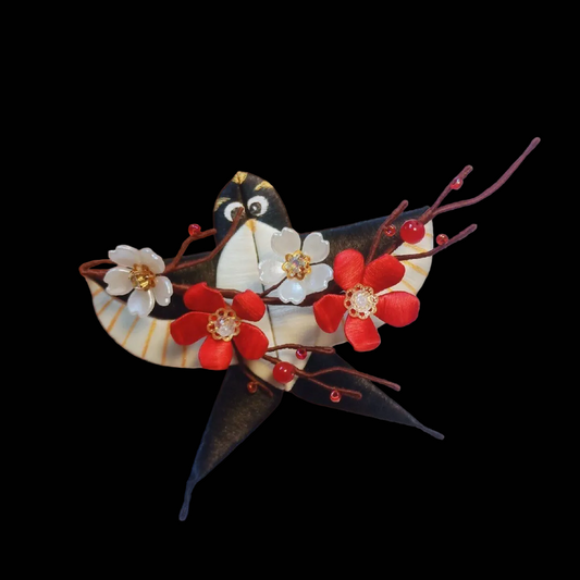 Handcrafted Chanhua swallow kite brooch featuring black, white, and red thread-wrapping with flower and branch details.