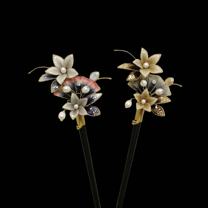 Gold and grey Ronghua ink wash hairpin with gradient golden-brown and dark grey petals, gold foil detailing, and pearl drop tassel on a dark wooden pin